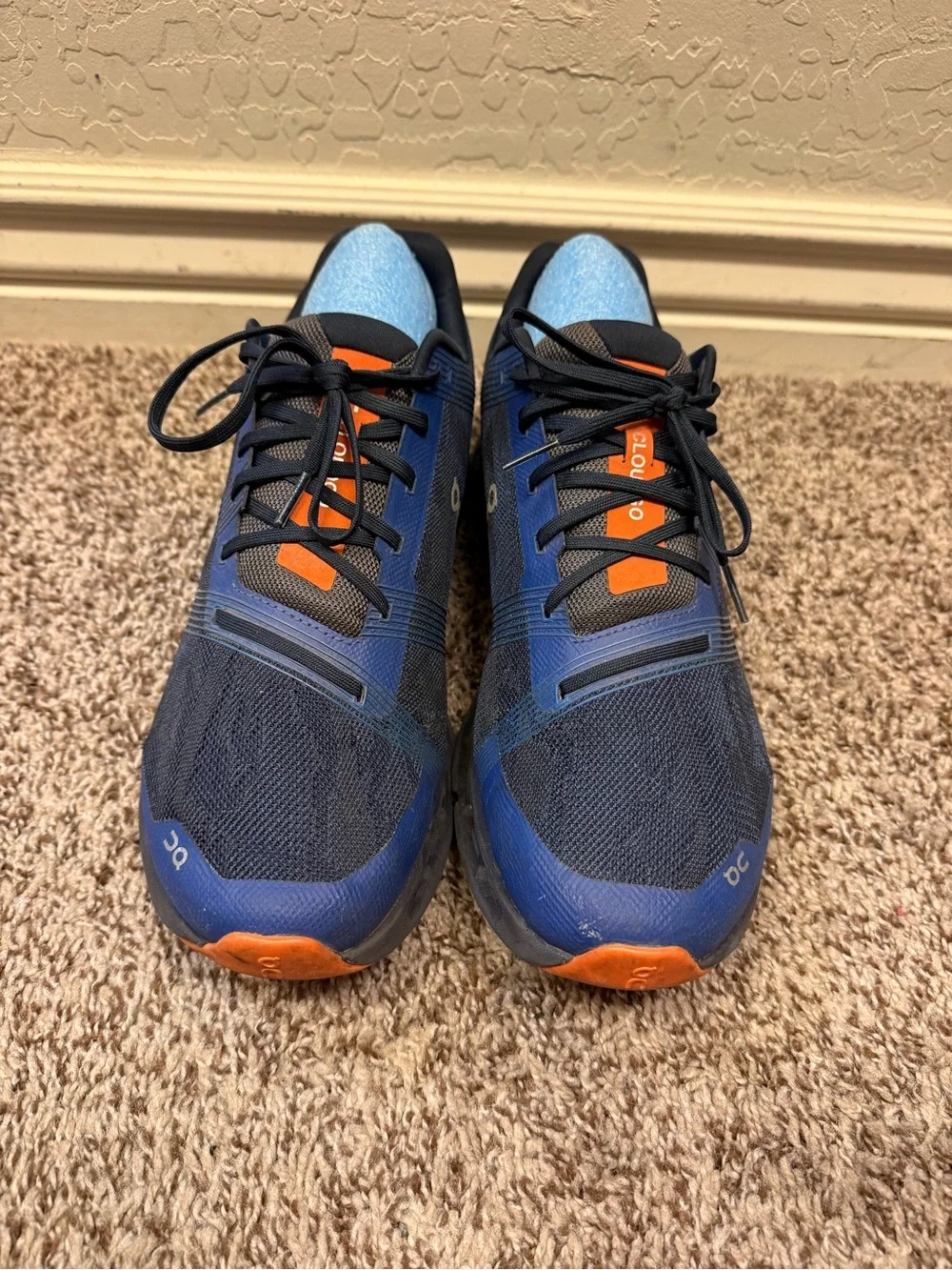 On Running Men’s Navy and Black Cloudtec Trainer with Orange Accents